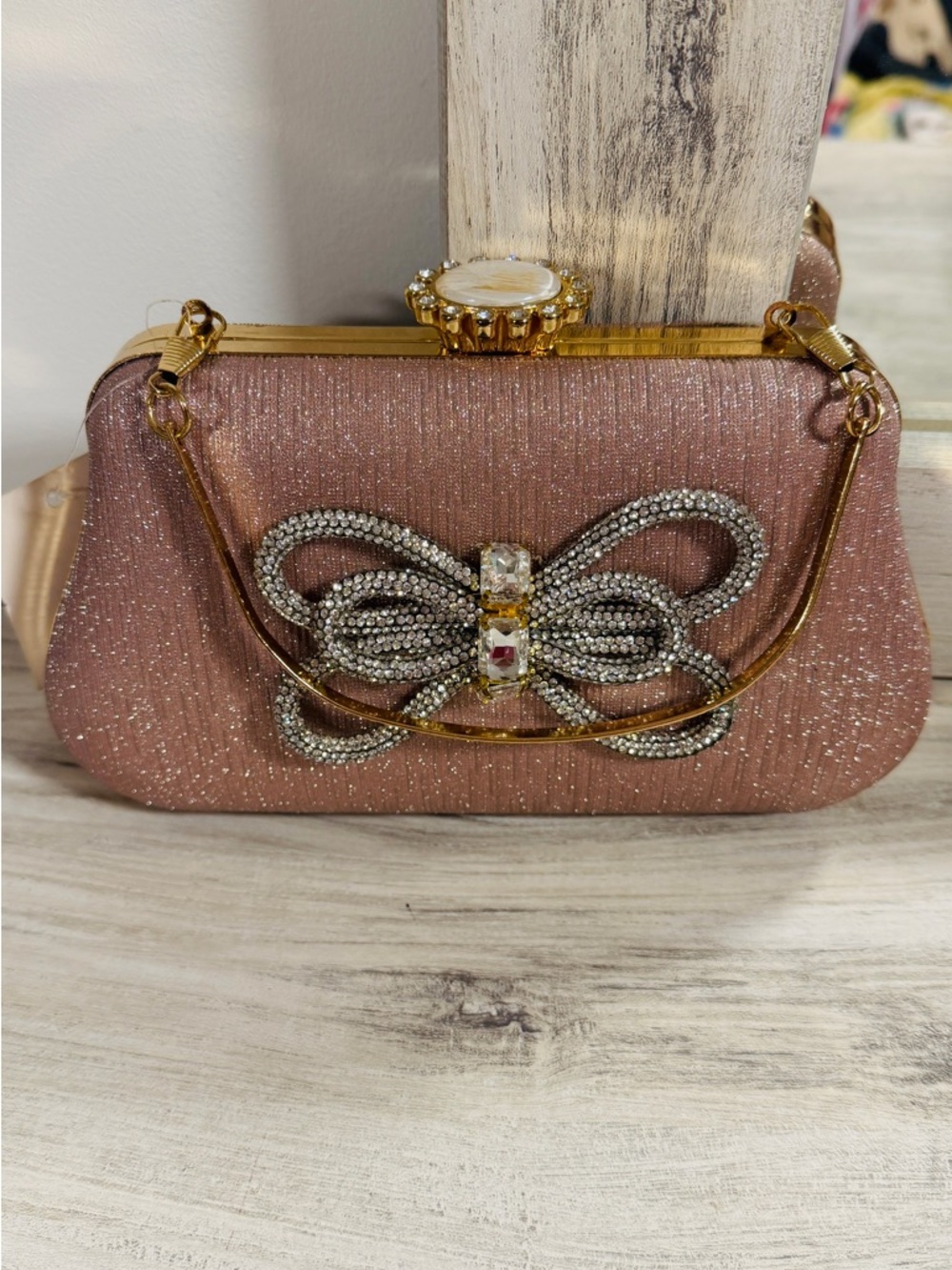 Elegant Rose Gold Evening Clutch with Crystal Bow Accent